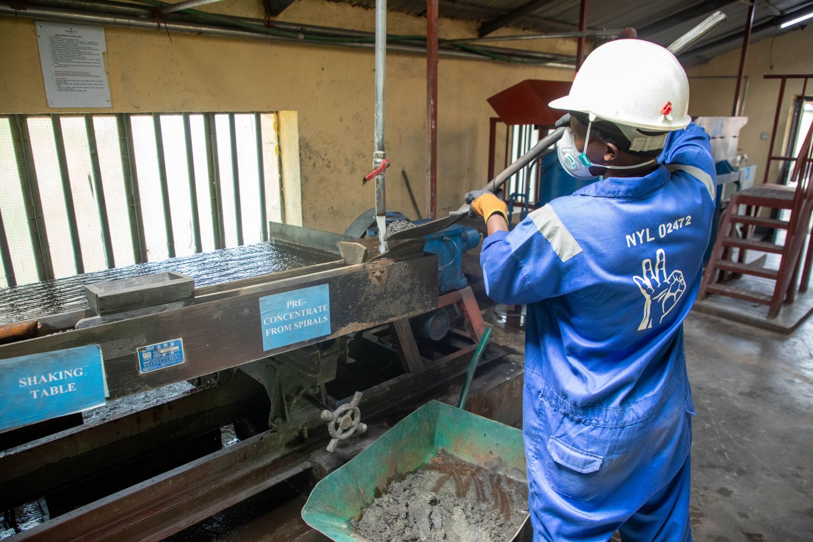 Worker processing minerals at a facility